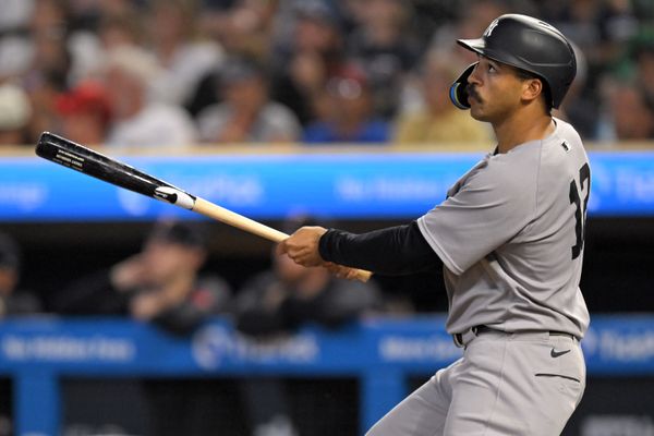 Sep 17, 2025; Minneapolis, Minnesota, USA;  New York Yankees outfielder Trent Grisham (12) flies out against the Minnesota Twins during the sixth inning at Target Field. Mandatory Credit: Nick Wosika-Imagn Images

