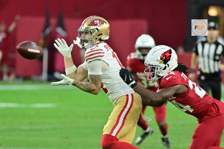 Jan 5, 2025; Glendale, Arizona, USA;  San Francisco 49ers wide receiver Ricky Pearsall (14) catches a pass as Arizona Cardinals cornerback Starling Thomas V (24) defends in the second half at State Farm Stadium. Credit: Matt Kartozian-Imagn Images