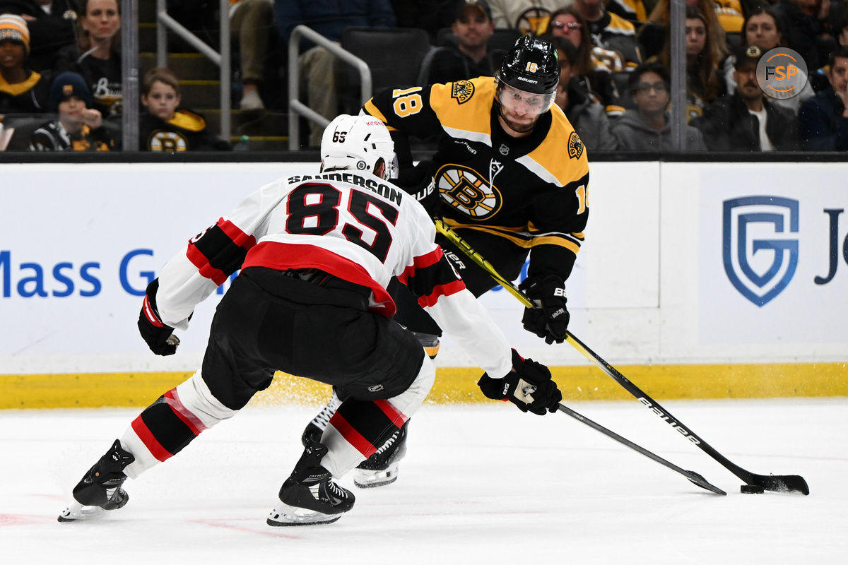 Nov 9, 2024; Boston, Massachusetts, USA; Ottawa Senators defenseman Jake Sanderson (85) defends Boston Bruins center Pavel Zacha (18) during the third period at TD Garden. Credit: Brian Fluharty-Imagn Images