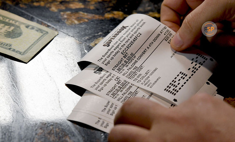 The betting line and some of the more than 400 proposition bets for Super Bowl LI between the Atlanta Falcons and the New England Patriots are displayed at the Race & Sports SuperBook at the Westgate Las Vegas Resort & Casino on January 26, 2017 in Las Vegas, Nevada.