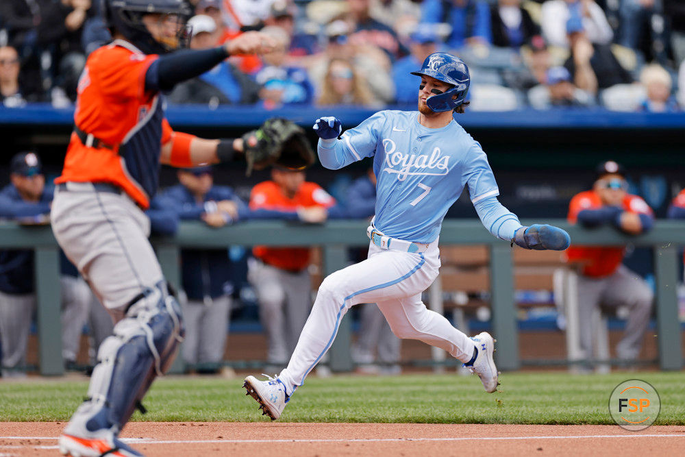 KANSAS CITY, MO - APRIL 11: Kansas City Royals shortstop Bobby Witt Jr. (7) slides at home to score a run in the first inning of an MLB game against the Houston Astros on April 11, 2024 at Kauffman Stadium in Kansas City, Missouri. (Photo by Joe Robbins/Icon Sportswire)