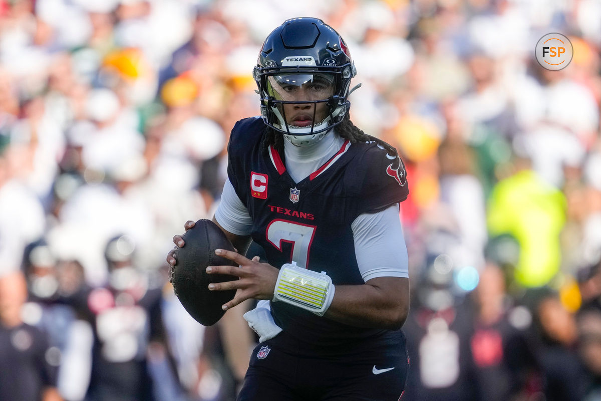 Oct 20, 2024; Green Bay, Wisconsin, USA;  Houston Texans quarterback C.J. Stroud (7) looks to throw a pass during the second quarter against the Green Bay Packers at Lambeau Field. Credit: Jeff Hanisch-Imagn Images