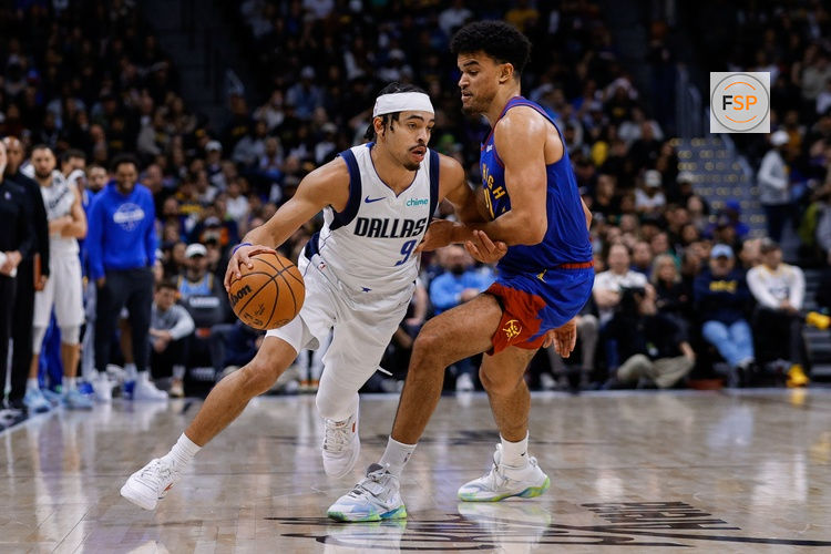 Dec 1, 2025; Denver, Colorado, USA; Dallas Mavericks guard Ryan Nembhard (9) controls the ball under pressure from Denver Nuggets forward Spencer Jones (21) in the fourth quarter at Ball Arena. Credit: Isaiah J. Downing-Imagn Images