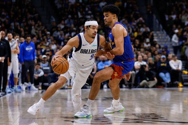 Dec 1, 2025; Denver, Colorado, USA; Dallas Mavericks guard Ryan Nembhard (9) controls the ball under pressure from Denver Nuggets forward Spencer Jones (21) in the fourth quarter at Ball Arena. Mandatory Credit: Isaiah J. Downing-Imagn Images