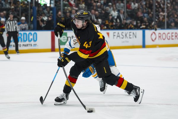 Dec 11, 2025; Vancouver, British Columbia, CAN; Vancouver Canucks defenseman Quinn Hughes (43) shoots against the Buffalo Sabres in the first period at Rogers Arena. Mandatory Credit: Bob Frid-Imagn Images