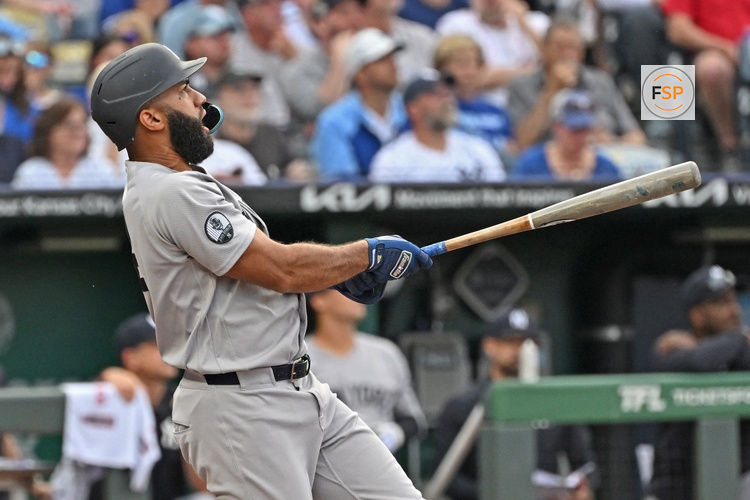 May 26, 2026; Kansas City, Missouri, USA;  New York Yankees third baseman Amed Rosario (14) hits a two-run home run in the first inning against the Kansas City Royals at Kauffman Stadium. Credit: Peter Aiken-Imagn Images