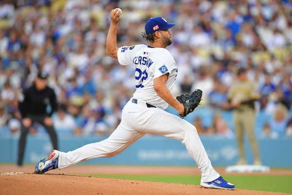 Aug 15, 2025; Los Angeles, California, USA;  Los Angeles Dodgers pitcher Clayton Kershaw (22) throws against the San Diego Padres during the first inning at Dodger Stadium. Mandatory Credit: Gary A. Vasquez-Imagn Images