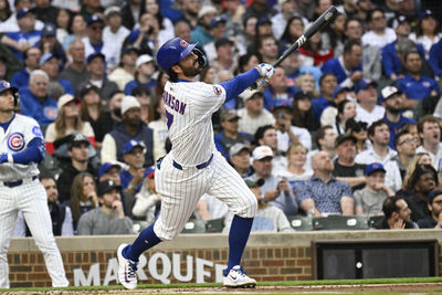 Apr 22, 2025; Chicago, Illinois, USA;  Chicago Cubs shortstop Dansby Swanson (7) hits an RBI triple during the first inning against the Los Angeles Dodgers at Wrigley Field. Mandatory Credit: Matt Marton-Imagn Images