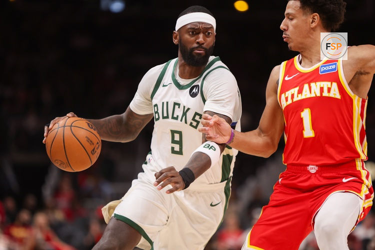 Mar 14, 2026; Atlanta, Georgia, USA; Milwaukee Bucks forward Bobby Portis (9) is defended by forward Jalen Johnson (1) in the first quarter at State Farm Arena. Credit: Brett Davis-Imagn Images

