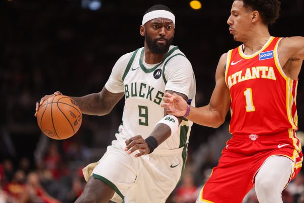Mar 14, 2026; Atlanta, Georgia, USA; Milwaukee Bucks forward Bobby Portis (9) is defended by forward Jalen Johnson (1) in the first quarter at State Farm Arena. Mandatory Credit: Brett Davis-Imagn Images
