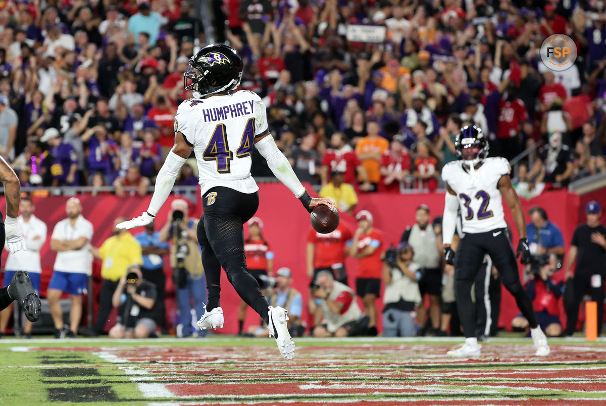 Oct 21, 2024; Tampa, Florida, USA; Baltimore Ravens cornerback Marlon Humphrey (44) celebrates after he intercepted the ball in the end zone against the Tampa Bay Buccaneers during the first half at Raymond James Stadium. Credit: Kim Klement Neitzel-Imagn Images