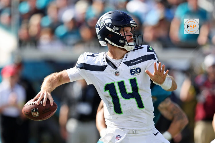 Oct 12, 2025; Jacksonville, Florida, USA; Seattle Seahawks quarterback Sam Darnold (14) drops back to make a pass during the second half against the Jacksonville Jaguars at EverBank Stadium. Credit: Morgan Tencza-Imagn Images