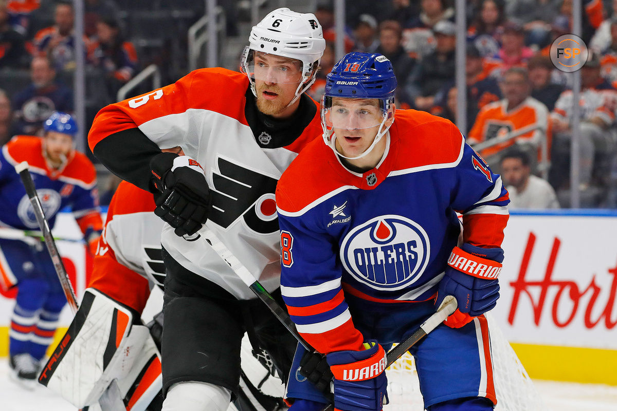 Oct 15, 2024; Edmonton, Alberta, CAN; Edmonton Oilers forward Zach Hyman (18) and Philadelphia Flyers defensemen Travis Sanheim (6) battle for position  during the third period at Rogers Place. Credit: Perry Nelson-Imagn Images