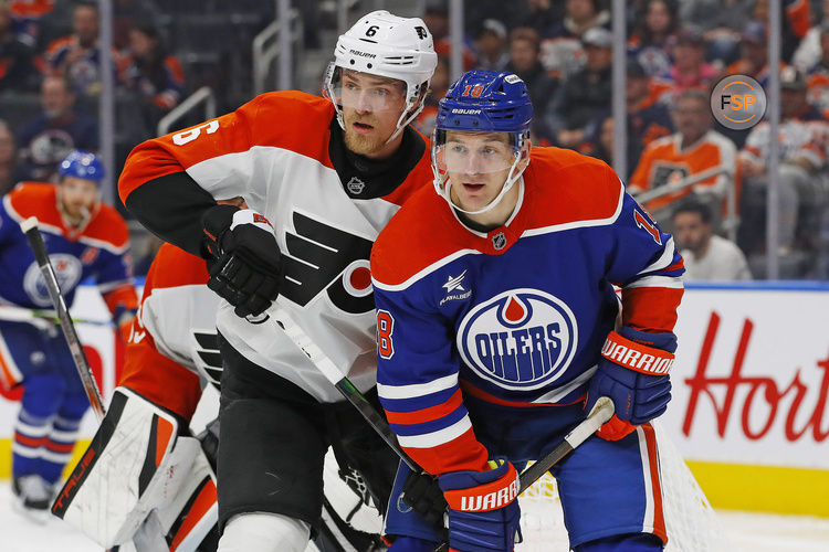 Oct 15, 2024; Edmonton, Alberta, CAN; Edmonton Oilers forward Zach Hyman (18) and Philadelphia Flyers defensemen Travis Sanheim (6) battle for position  during the third period at Rogers Place. Credit: Perry Nelson-Imagn Images