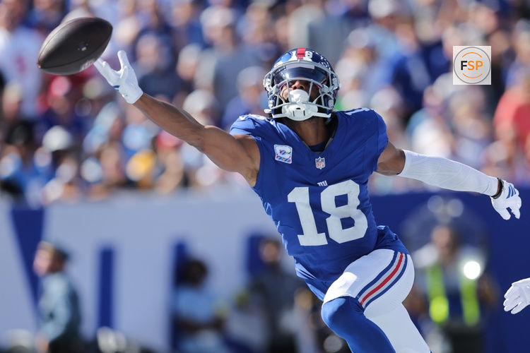 Sep 28, 2025; East Rutherford, New Jersey, USA; New York Giants wide receiver Darius Slayton (18) attempts to make a catch during the second quarter against the Los Angeles Chargers at MetLife Stadium. Credit: Brad Penner-Imagn Images
