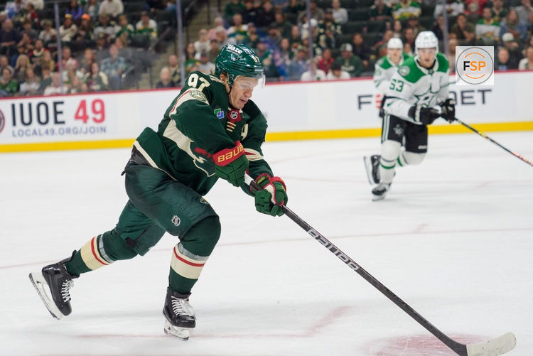 Sep 25, 2025; Saint Paul, Minnesota, USA; Minnesota Wild left wing Kirill Kaprizov (97) controls a pass against the Dallas Stars in the third period at Grand Casino Arena. Credit: Matt Blewett-Imagn Images