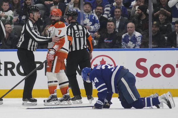 Mar 12, 2026; Toronto, Ontario, CAN; Anaheim Ducks defenseman Radko Gudas (7) looks at an injured Toronto Maple Leafs forward Auston Matthews (34) after he delivered a knee on knee hit during the second period at Scotiabank Arena. Mandatory Credit: John E. Sokolowski-Imagn Images