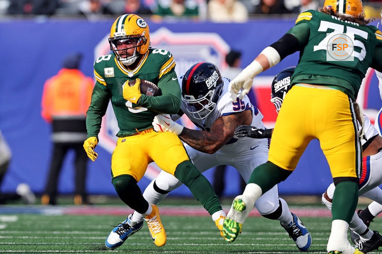 Nov 16, 2025; East Rutherford, New Jersey, USA; Green Bay Packers running back Josh Jacobs (8) runs the ball against New York Giants defensive tackle Roy Robertson-Harris (95) during the first quarter at MetLife Stadium. Credit: Vincent Carchietta-Imagn Images