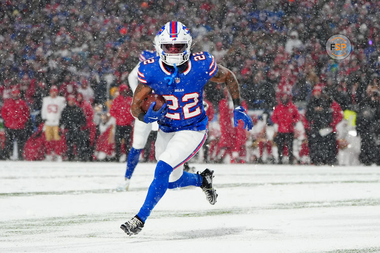 Dec 1, 2024; Orchard Park, New York, USA; Buffalo Bills running back Ray Davis (22) runs with the ball for a touchdown against the San Francisco 49ers during the first half at Highmark Stadium. Credit: Gregory Fisher-Imagn Images