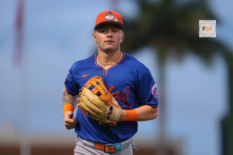 Mar 13, 2026; West Palm Beach, Florida, USA; New York Mets left fielder A.J. Ewing (97) returns to the dugout against the Washington Nationals during the second inning at CACTI Park of the Palm Beaches. Credit: Sam Navarro-Imagn Images