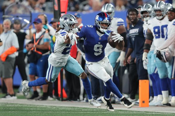 Sep 13, 2026; East Rutherford, New Jersey, USA;  New York Giants tight end Isaiah Likely (9) carries the ball defended by Dallas Cowboys cornerback Shavon Revel Jr. (28) during the second quarter at MetLife Stadium.  Mandatory Credit: Brad Penner-Imagn Images