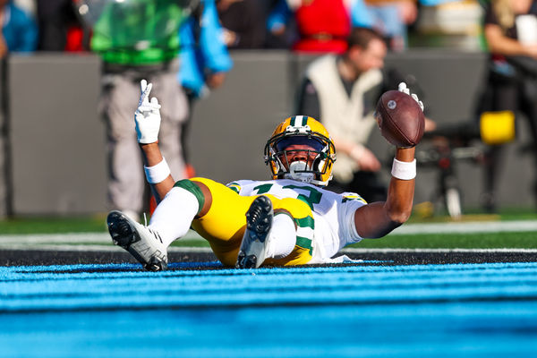 CHARLOTTE, NC - DECEMBER 24: Dontayvion Wicks #13 of the Green Bay Packers celebrates a touchdown during an NFL game against the Carolina Panthers at Bank of America Stadium on December 24, 2023 in Charlotte, NC. (Photo by David Jensen/Icon Sportswire)