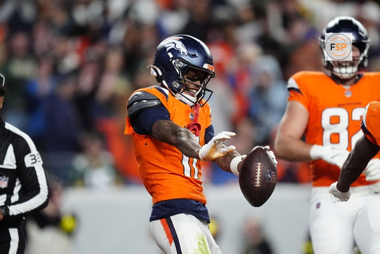 Dec 14, 2025; Denver, Colorado, USA: Denver Broncos wide receiver Troy Franklin (11) celebrates following a touchdown during the third quarter against the Green Bay Packers at Empower Field at Mile High. Credit: Ron Chenoy-Imagn Images