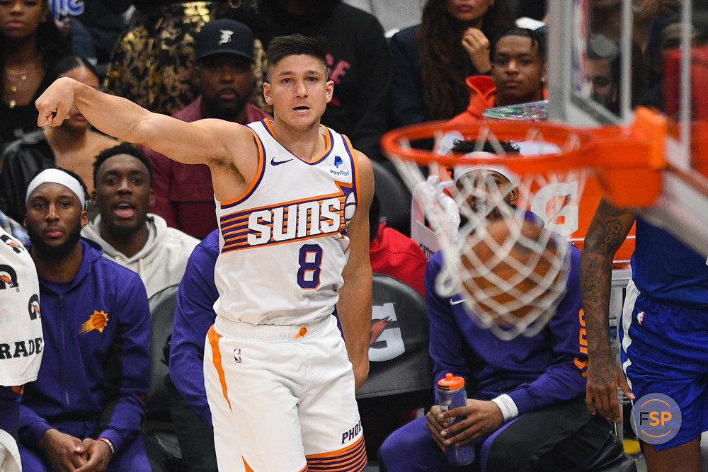 LOS ANGELES, CA - JANUARY 08: Phoenix Suns Forward Grayson Allen (8) watches his three pointer go through the basket during a NBA game between the Phoenix Suns and the Los Angeles Clippers on January 8, 2023 at Crypto.com Arena in Los Angeles, CA. (Photo by Brian Rothmuller/Icon Sportswire)