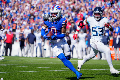 Oct 20, 2024; Orchard Park, New York, USA; Buffalo Bills wide receiver Keon Coleman (0) runs with the ball after making a catch against Tennessee Titans linebacker Ernest Jones IV (53) during the first half at Highmark Stadium. Mandatory Credit: Gregory Fisher-Imagn Images