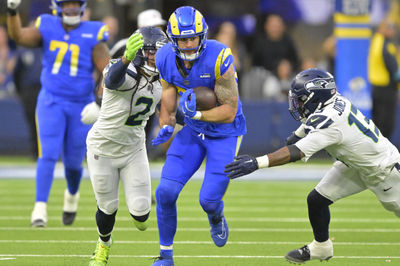 Jan 5, 2025; Inglewood, California, USA; Los Angeles Rams tight end Tyler Higbee (89) runs for a first down before he is stopped by Seattle Seahawks safety Rayshawn Jenkins (2) and linebacker Ernest Jones IV (13) in the second half at SoFi Stadium. Mandatory Credit: Jayne Kamin-Oncea-Imagn Images