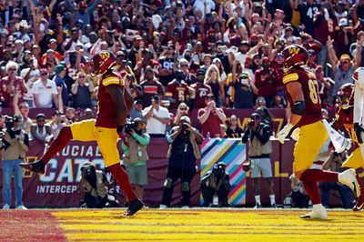 Oct 6, 2024; Landover, Maryland, USA; Washington Commanders running back Brian Robinson Jr. (8) scores a touchdown  during the second quarter against the Cleveland Browns at NorthWest Stadium. Mandatory Credit: Peter Casey-Imagn Images