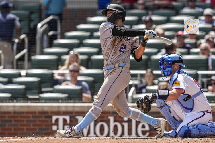 Jun 15, 2025; Cumberland, Georgia, USA; Colorado Rockies right fielder Tyler Freeman (2) singles to drive in a run against the Atlanta Braves during the seventh inning at Truist Park. Credit: Dale Zanine-Imagn Images