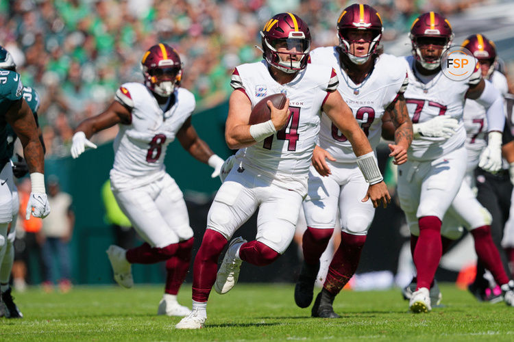 PHILADELPHIA, PA - OCTOBER 01: Washington Commanders quarterback Sam Howell (14) runs for a first down during the game between the Philadelphia Eagles and the Washington Commanders on October 1, 2023, at Lincoln Financial Field. (Photo by Andy Lewis/Icon Sportswire)