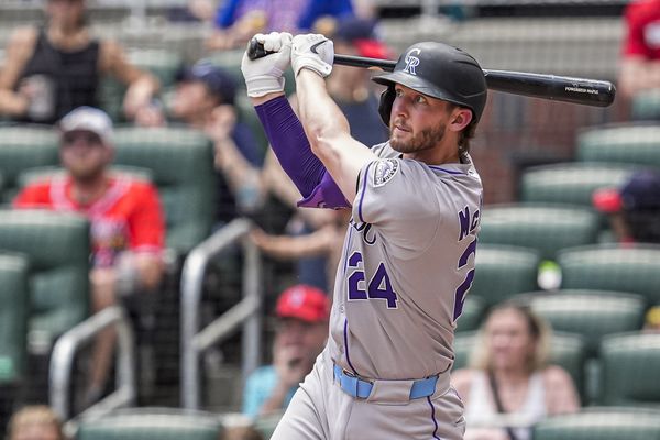 Jun 15, 2025; Cumberland, Georgia, USA; Colorado Rockies third baseman Ryan McMahon (24) hits a home run against the Atlanta Braves during the seventh inning at Truist Park. Mandatory Credit: Dale Zanine-Imagn Images