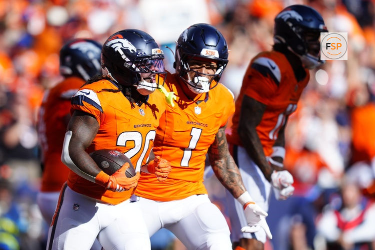 Sep 20, 2026; Denver, Colorado, USA;  Denver Broncos running back Jonah Coleman (20) celebrates with tight end Evan Engram (1) after scoring a touchdown during the fourth quarter against the Jacksonville Jaguars at Empower Field at Mile High.  Credit: Ron Chenoy-Imagn Images