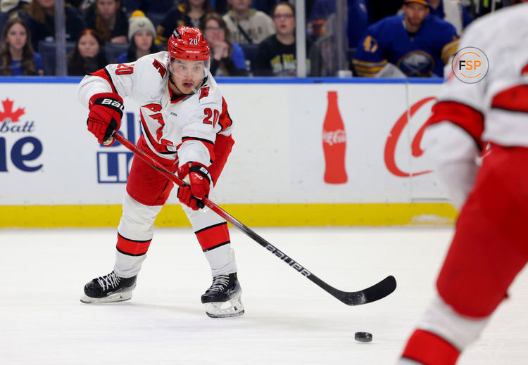 Jan 15, 2025; Buffalo, New York, USA;  Carolina Hurricanes center Sebastian Aho (20) makes a pass during the first period against the Buffalo Sabres at KeyBank Center. Credit: Timothy T. Ludwig-Imagn Images