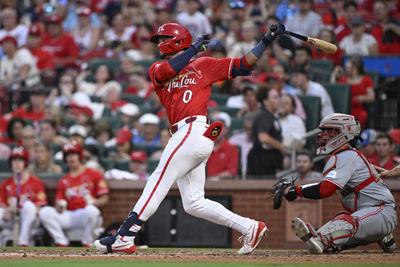 Jun 20, 2025; St. Louis, Missouri, USA; St. Louis Cardinals shortstop Masyn Winn (0) hits an RBI single against the Cincinnati Reds in the seventh inning at Busch Stadium. Mandatory Credit: Joe Puetz-Imagn Images