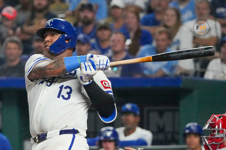 Aug 19, 2024; Kansas City, Missouri, USA; Kansas City Royals catcher Salvador Perez (13) hits a two-run double against the Los Angeles Angels in the seventh inning at Kauffman Stadium. Credit: Denny Medley-USA TODAY Sports