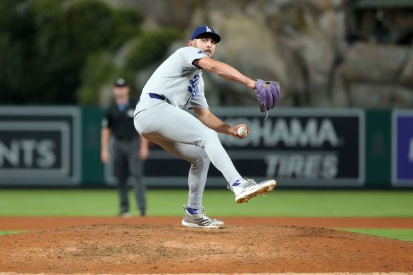 Aug 12, 2025; Anaheim, California, USA; Los Angeles Dodgers relief pitcher Alex Vesia (51) throws against the Los Angeles Angels at Angel Stadium. Mandatory Credit: Kirby Lee-Imagn Images