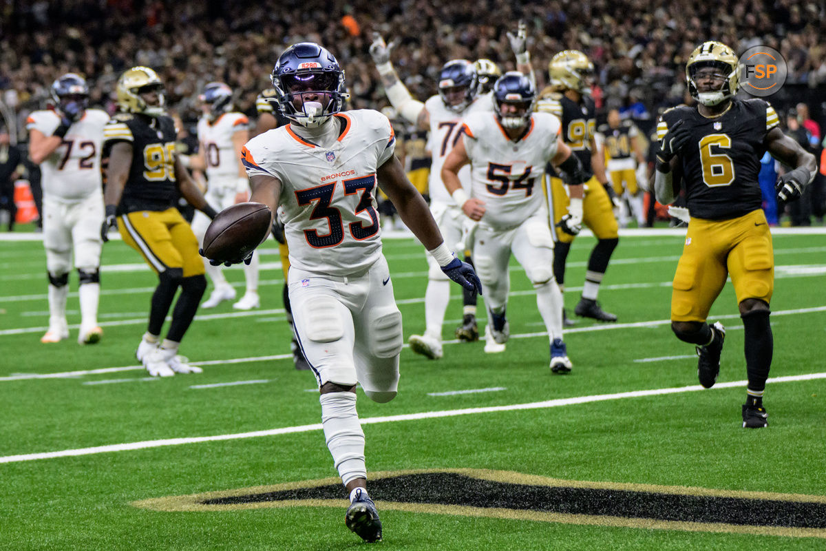 Oct 17, 2024; New Orleans, Louisiana, USA; Denver Broncos running back Javonte Williams (33) scores a touchdown against the New Orleans Saints during the second quarter at Caesars Superdome. Credit: Matthew Hinton-Imagn Images