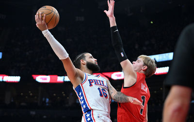 Oct 25, 2024; Toronto, Ontario, CAN;  Philadelphia 76ers forward Caleb Martin (16) shoots the ball as Toronto Raptors forward Gradey Dick (1) defends in the first half at Scotiabank Arena. Mandatory Credit: Dan Hamilton-Imagn Images