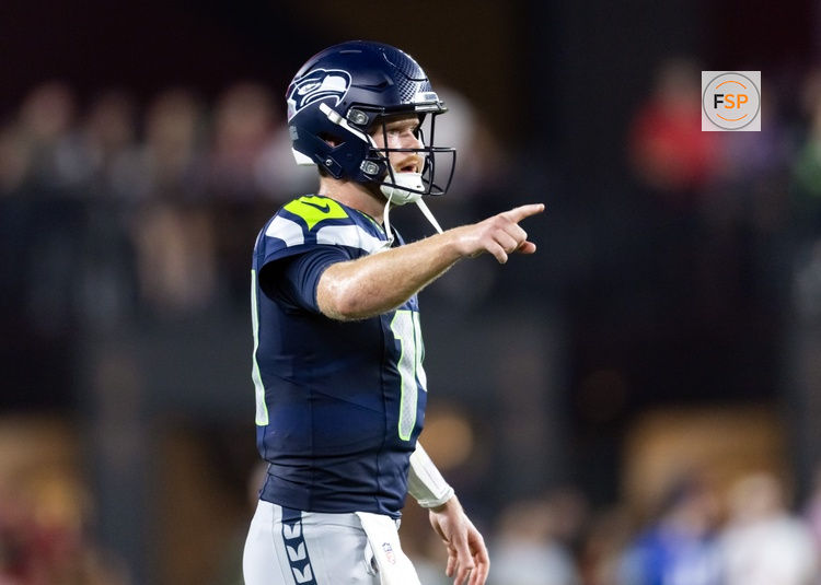 Sep 25, 2025; Glendale, Arizona, USA; Seattle Seahawks quarterback Sam Darnold (14) reacts against the Arizona Cardinals at State Farm Stadium. Credit: Mark J. Rebilas-Imagn Images