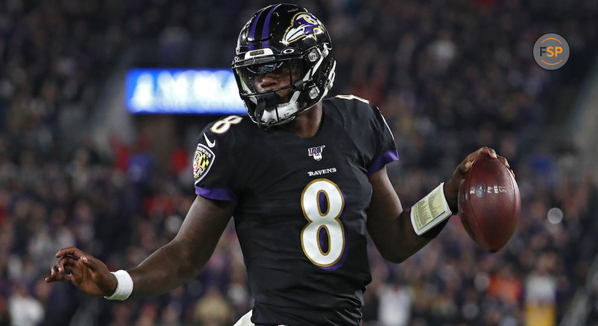 BALTIMORE, MARYLAND - NOVEMBER 03: Quarterback Lamar Jackson #8 of the Baltimore Ravens scores a first quarter touchdown  against the New England Patriots at M&T Bank Stadium on November 3, 2019 in Baltimore, Maryland. (Photo by Todd Olszewski/Getty Images)