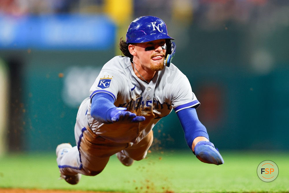 PHILADELPHIA, PA - AUGUST 04:  Bobby Witt Jr. #7 of the Kansas City Royals dives into third base during the game against the Philadelphia Phillies on August 4, 2023 at Citizens Bank Park in Philadelphia, Pennsylvania.  (Photo by Rich Graessle/Icon Sportswire)