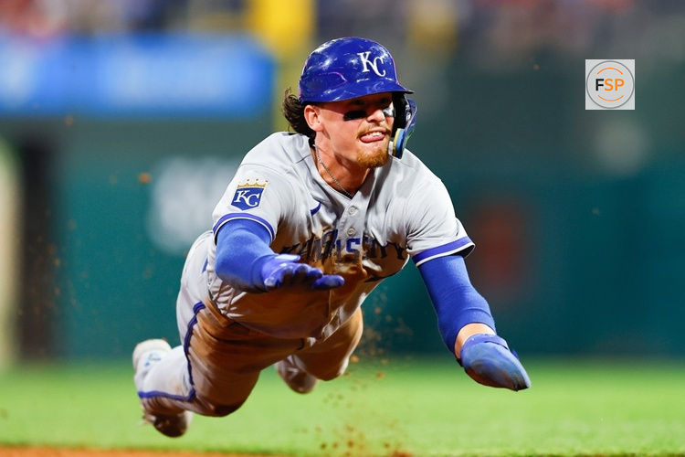 PHILADELPHIA, PA - AUGUST 04:  Bobby Witt Jr. #7 of the Kansas City Royals dives into third base during the game against the Philadelphia Phillies on August 4, 2023 at Citizens Bank Park in Philadelphia, Pennsylvania.  (Photo by Rich Graessle/Icon Sportswire)
