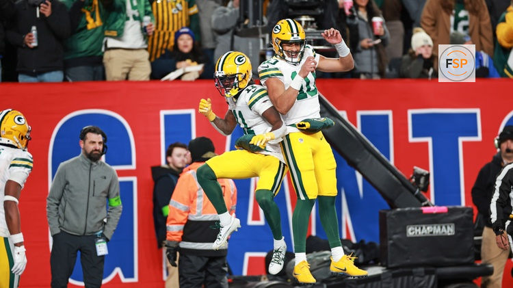 Dec 11, 2023; East Rutherford, New Jersey, USA; Green Bay Packers wide receiver Jayden Reed (11) and Green Bay Packers quarterback Jordan Love (10) celebrate after a touchdown during the second quarter against the New York Giants at MetLife Stadium. Credit: Vincent Carchietta-USA TODAY Sports