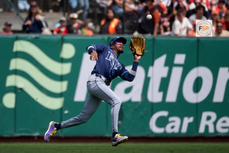 Aug 17, 2025; San Francisco, California, USA; Tampa Bay Rays left fielder Chandler Simpson (14) catches a fly ball against the San Francisco Giants during the sixth inning at Oracle Park. Credit: Robert Edwards-Imagn Images