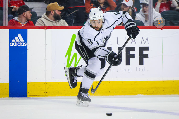 Mar 30, 2024; Calgary, Alberta, CAN; Los Angeles Kings defenseman Drew Doughty (8) passes the puck against the Calgary Flames during the third period at Scotiabank Saddledome. Credit: Sergei Belski-USA TODAY Sports