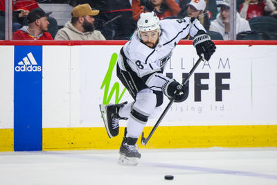 Mar 30, 2024; Calgary, Alberta, CAN; Los Angeles Kings defenseman Drew Doughty (8) passes the puck against the Calgary Flames during the third period at Scotiabank Saddledome. Mandatory Credit: Sergei Belski-USA TODAY Sports