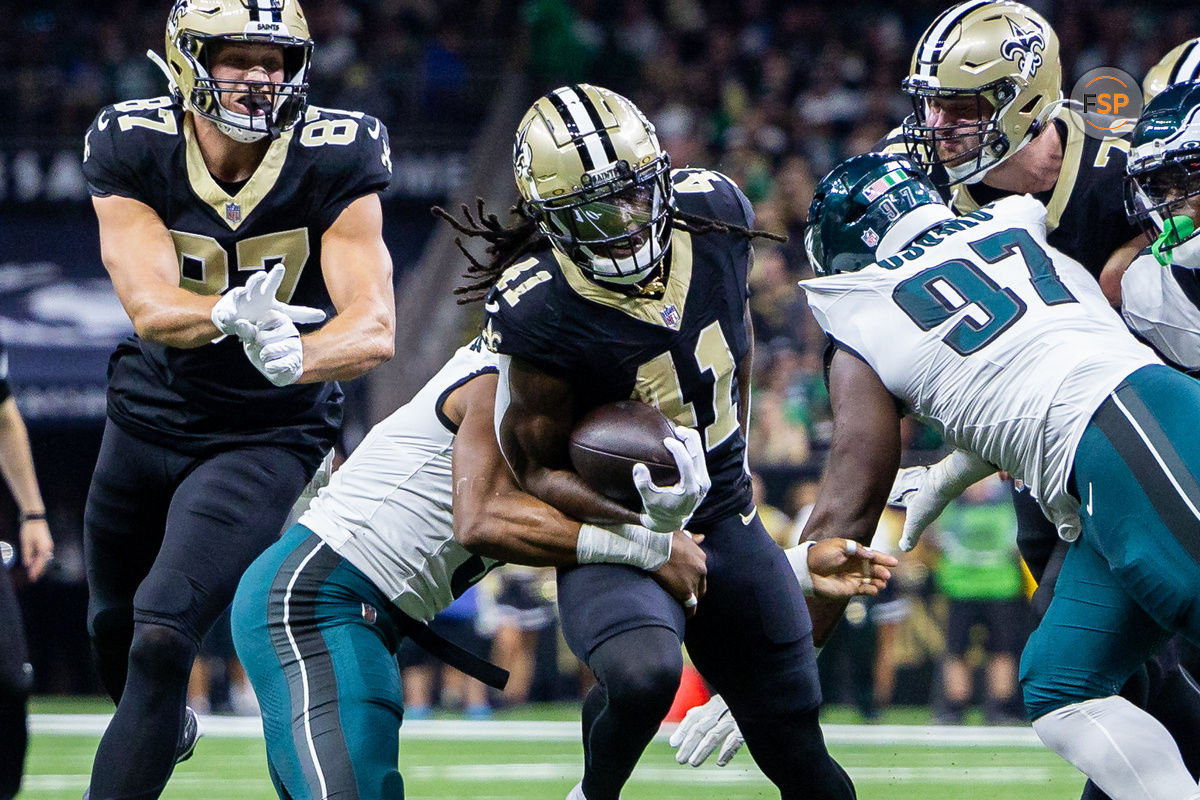 Sep 22, 2024; New Orleans, Louisiana, USA; New Orleans Saints running back Alvin Kamara (41) is tackled by Philadelphia Eagles linebacker Nolan Smith Jr. (3) during the first half at Caesars Superdome. Credit: Stephen Lew-Imagn Images